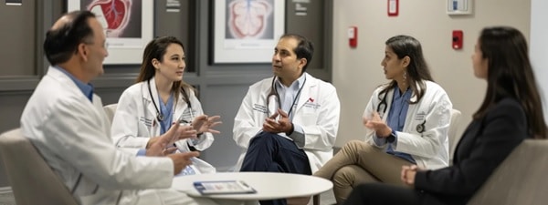 A group of physicians discuss vascular diseases